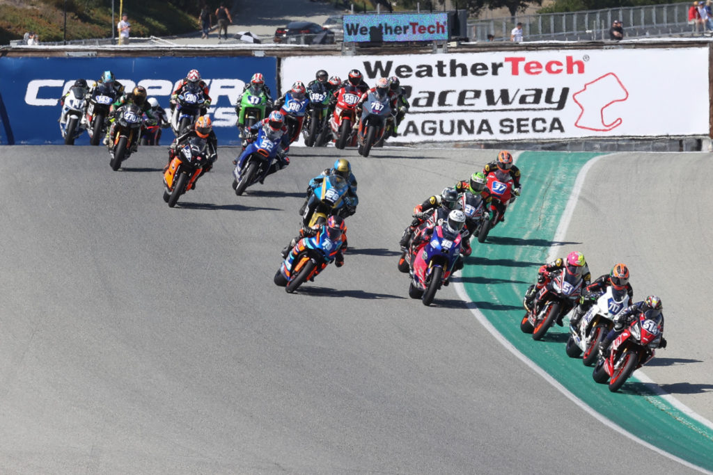 Anthony Mazziotto (516) leads Jody Barry (717), Kaleb De Keyrel (51), and the rest of the field through Turn One at the start of the Twins Cup race. Photo by Brian J. Nelson, courtesy MotoAmerica.