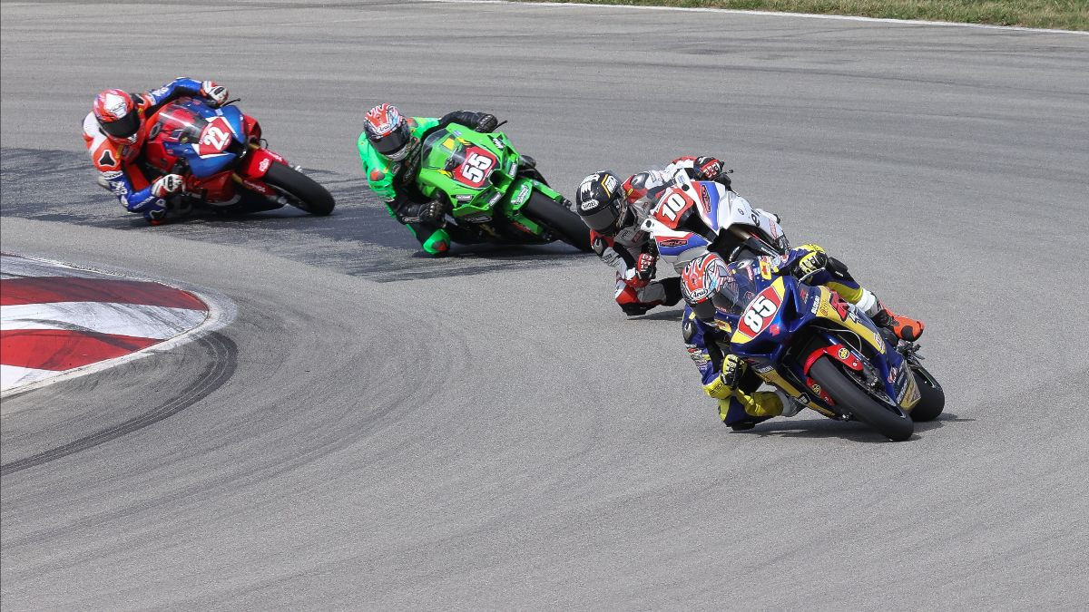 Jake Lewis (85) beat Travis Wyman (10) to win the Stock 1000 race on Sunday. Michael Gilbert (55) and Ashton Yates (22) finished fourth and seventh, respectively. Photo by Brian J. Nelson.