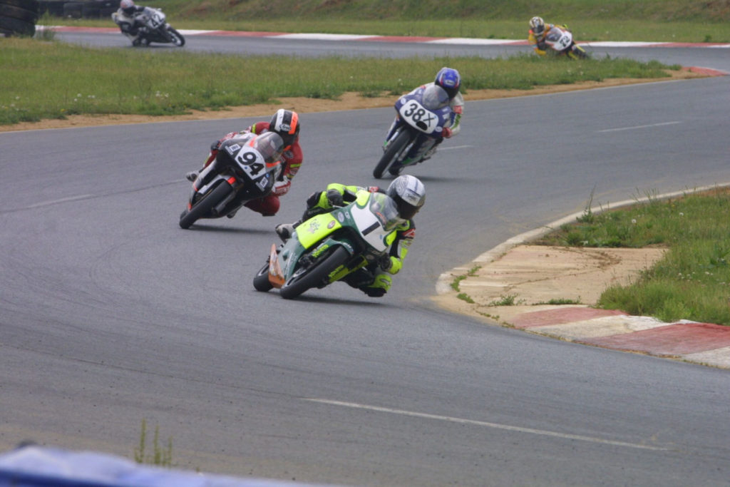 PJ Jacobsen (1) during a USGPRU 125cc Grand Prix race at Summit Point Raceway in 2007. Photo by etechphoto.com.