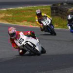 Jake Lewis (85), Hayden Gillim (69), and Miles Thornton (72) during a USGPRU Moriwaki Challenge Cup Powered by Honda race at Summit Point Raceway in 2008. Photo by etechphoto.com.