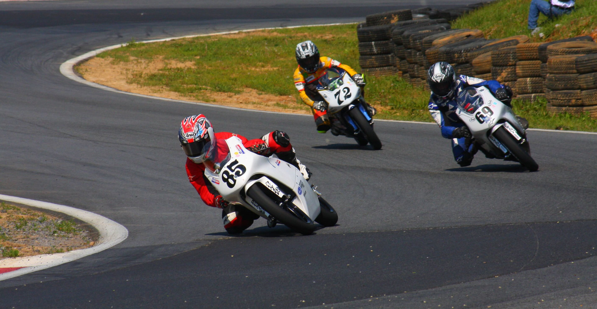 Jake Lewis (85), Hayden Gillim (69), and Miles Thornton (72) during a USGPRU Moriwaki Challenge Cup Powered by Honda race at Summit Point Raceway in 2008. Photo by etechphoto.com.