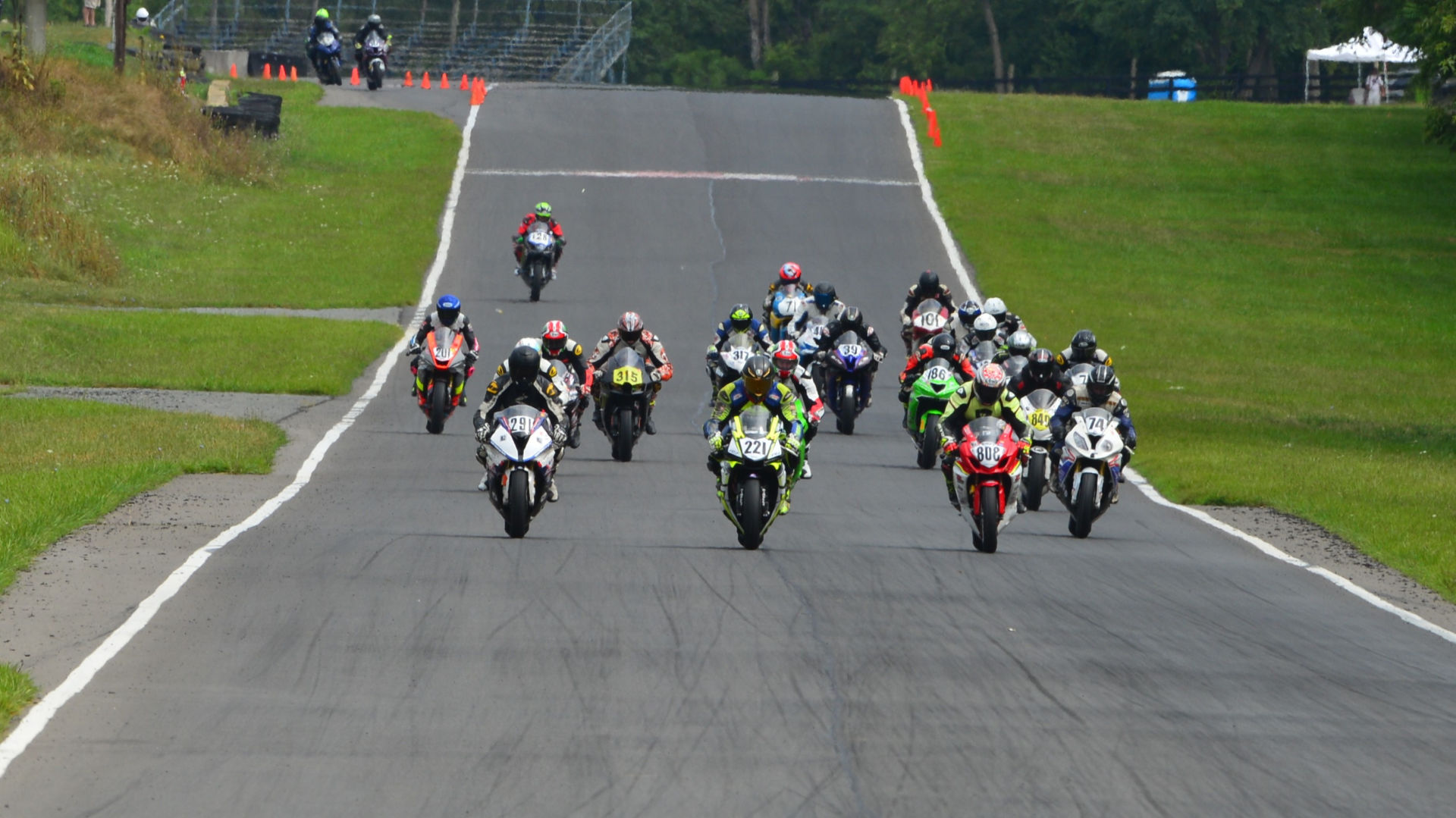 Washed Up Racing (808), J. Clark Racing (221), and Grease Monkey Racing (291) lead the ASRA Team Challenge field into Turn One at Summit Point Raceway. Photo by Lisa Theobald, courtesy ASRA.