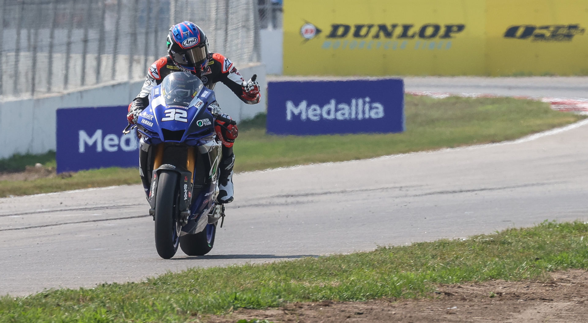 MotoAmerica Superbike racer Jake Gagne (32) with a Medallia sign in the background at Brainerd International Raceway. Photo by Brian J. Nelson.