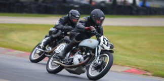 Scott Dell (53), riding a 1950 Vincent Comet, and Grant Spence, riding a 1950 AJS 350, at speed during the Class C Footshift race at Blackhawk Farms Raceway. Photo by etechphoto.com, courtesy AHRMA.