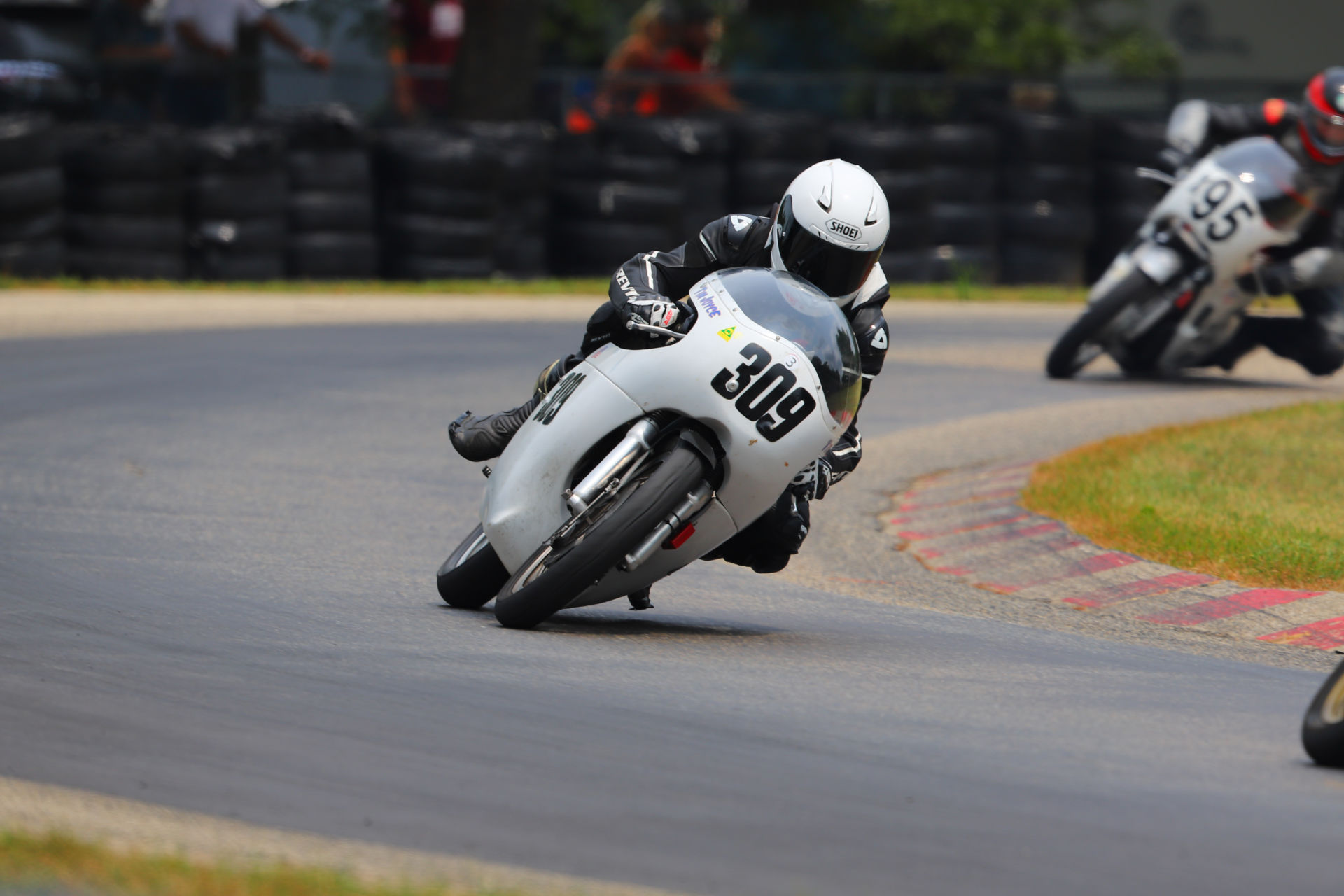 Tim Joyce (309) leading Andrew Mauk (X95) at Blackhawk Farms Raceway. Photo by etechphoto.com, courtesy AHRMA.