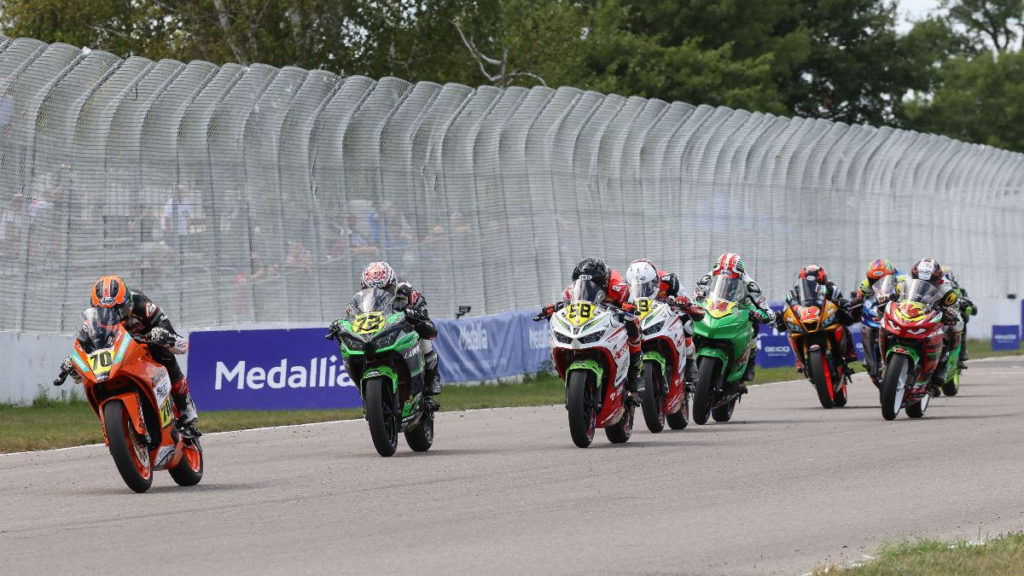 Race winner Tyler Scott (70) and Ben Gloddy (72) lead a horde of Junior Cup racers on Sunday at BIR. Photo by Brian J. Nelson.