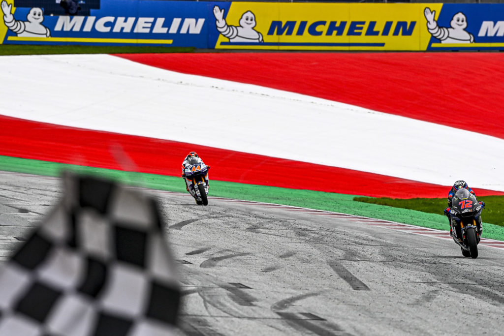 Marco Bezzecchi (72) leads Aron Canet (44) to the checkered flag. Photo courtesy Dorna.