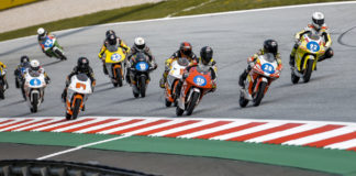 Kevin Farkas (28) leads Jakub Gurecky (59), Hungarian-American Rossi Moor (92), and the rest of the Northern Talent Cup field at the start of Race Two at Red Bull Ring. FIM and Dorna officials are raising the minimum age for racers competing on Grand Prix tracks. Photo courtesy Dorna.