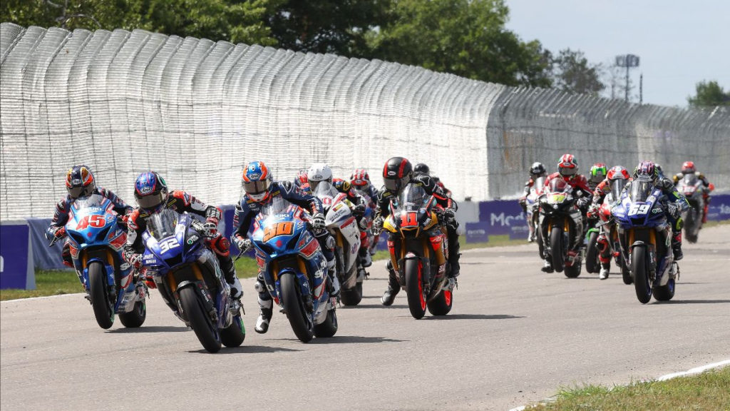 Jake Gagne (32) and Bobby Fong (50) get close off the start of Sunday's HONOS Superbike race at Brainerd International Raceway with Cameron Petersen (45), Mathew Scholtz (11), and JD Beach (69) giving chase. Photo by Brian J. Nelson.