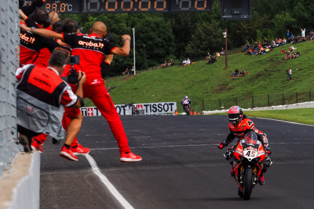 The Aruba.it Racing Ducati team cheers Scott Redding's (45) victory in Race Two. Photo courtesy Dorna.