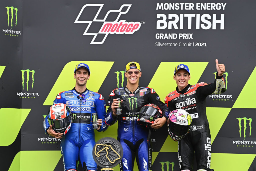 Winner Fabio Quartararo (center), runner-up Alex Rins (left), and third-place finisher Aleix Espargaro (right) on the podium at Silverstone. Photo courtesy Dorna.