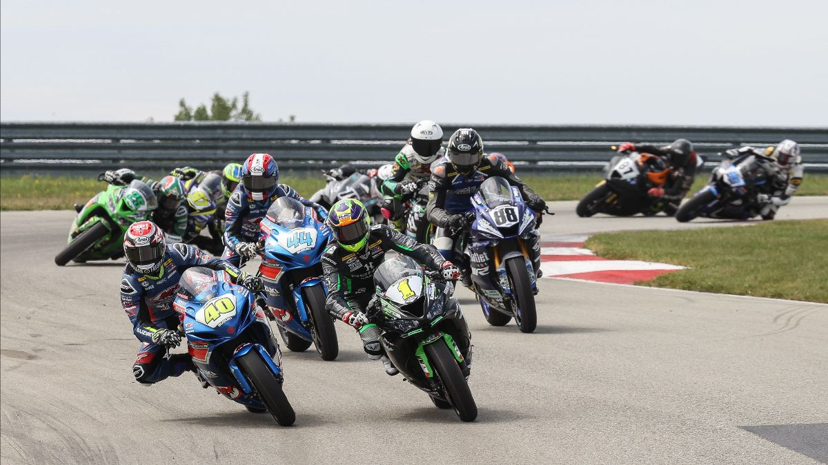 Sean Dylan Kelly (40) and Richie Escalante (1) fly in formation at the front of the Supersport pack on Sunday at PittRace. Photo by Brian J. Nelson.