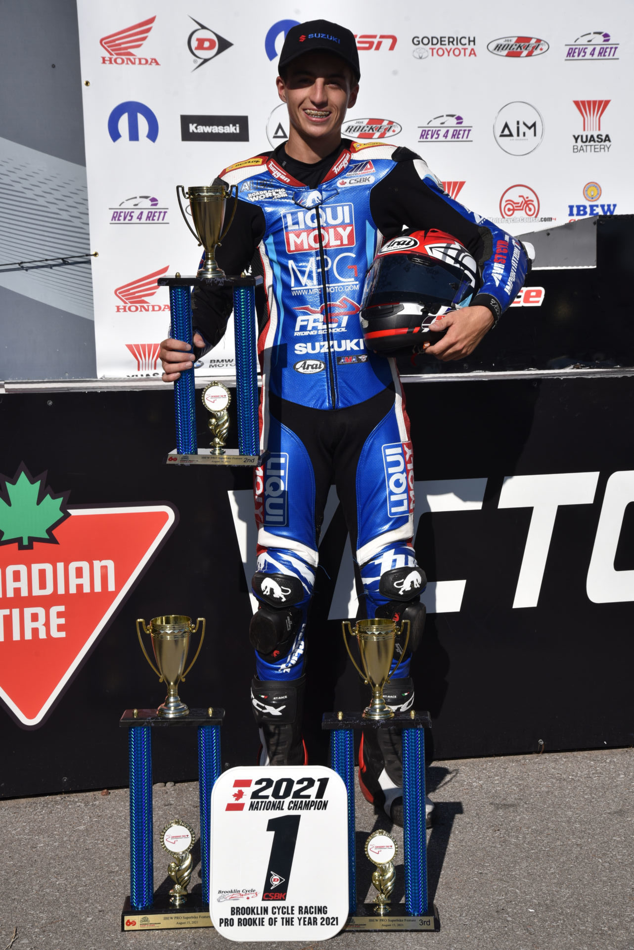 Alex Dumas with trophies at CTMP. Photo by Anik Sanfacon, courtesy of Alex Dumas.