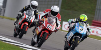 Ollie Walker (48), Carter Brown (74), and Sullivan Mounsey (4) battle for the lead at Silverstone. Photo courtesy Dorna.