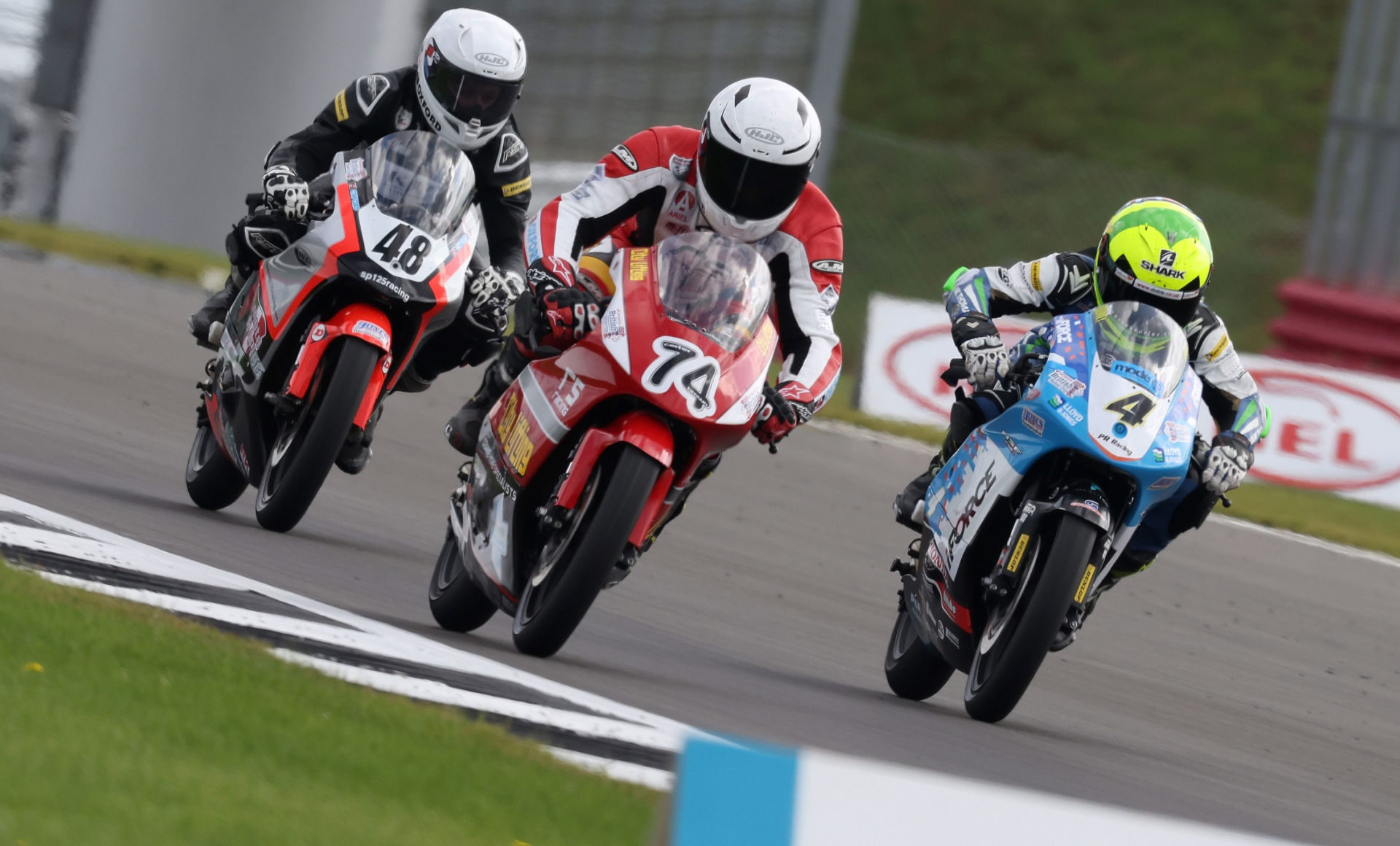 Ollie Walker (48), Carter Brown (74), and Sullivan Mounsey (4) battle for the lead at Silverstone. Photo courtesy Dorna.