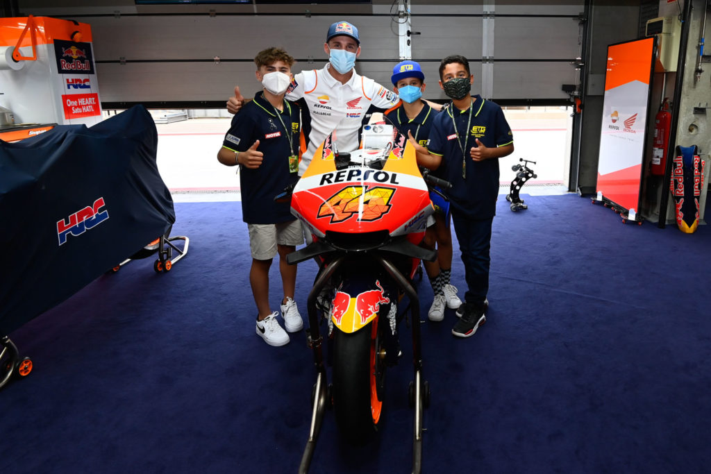 FIM MiniGP Spain Series ambassador Pol Espargaro with young Spanish racers in the Repsol Honda garage. Photo courtesy Dorna.