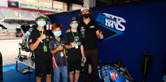 American Moto2 racer and MiniGP World Series ambassador Joe Roberts (far right) with FIM MiniGP North America stars (from left) Jayden Fernandez, Kensei Matsudaira, and Jesse James Shedden in the Italtrans Racing garage at COTA. Photo courtesy Dorna.