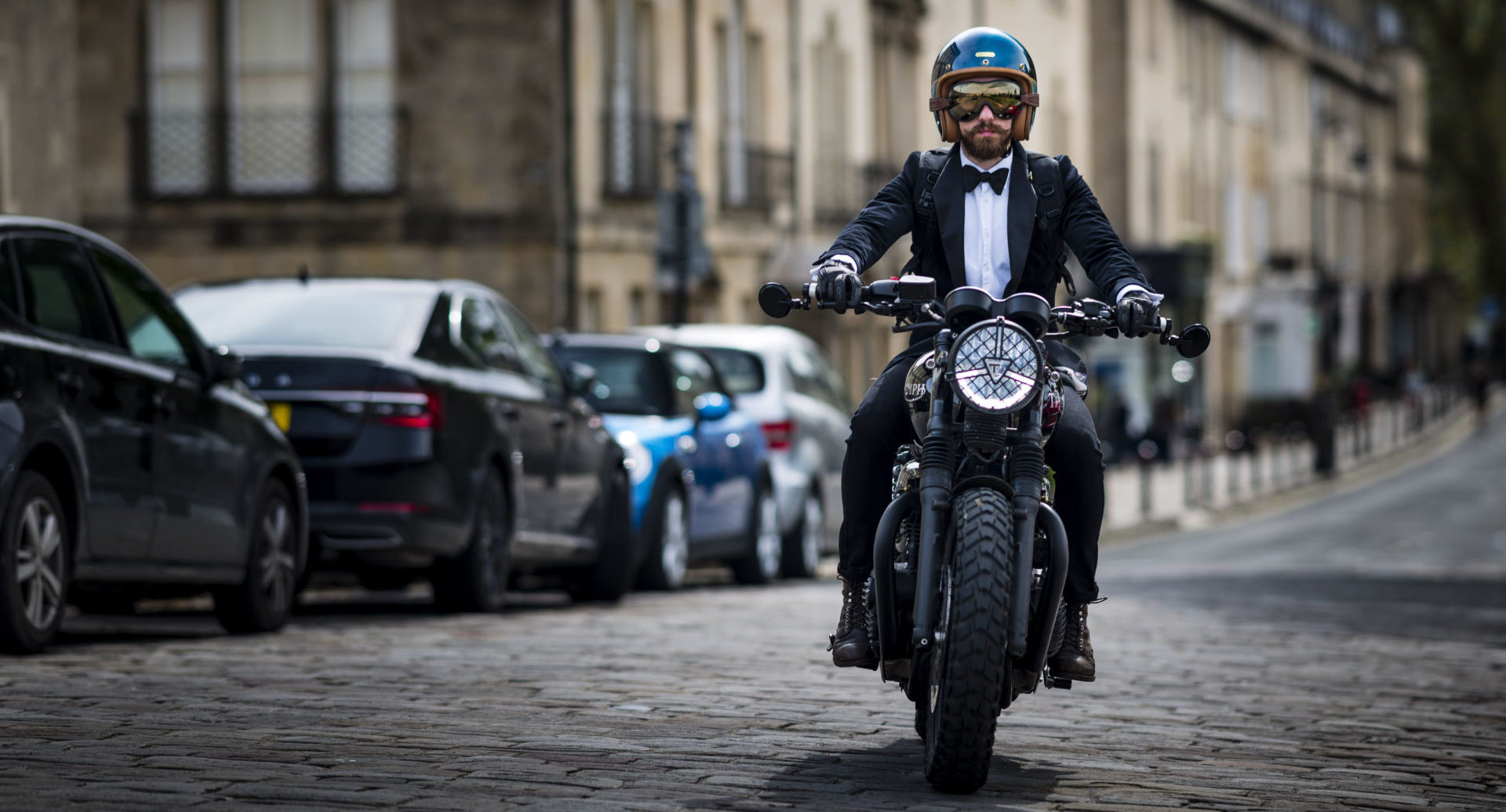 A well dressed participant on a Triumph motorcycle during a Distinguished Gentleman's Ride in England. Photo courtesy Triumph.