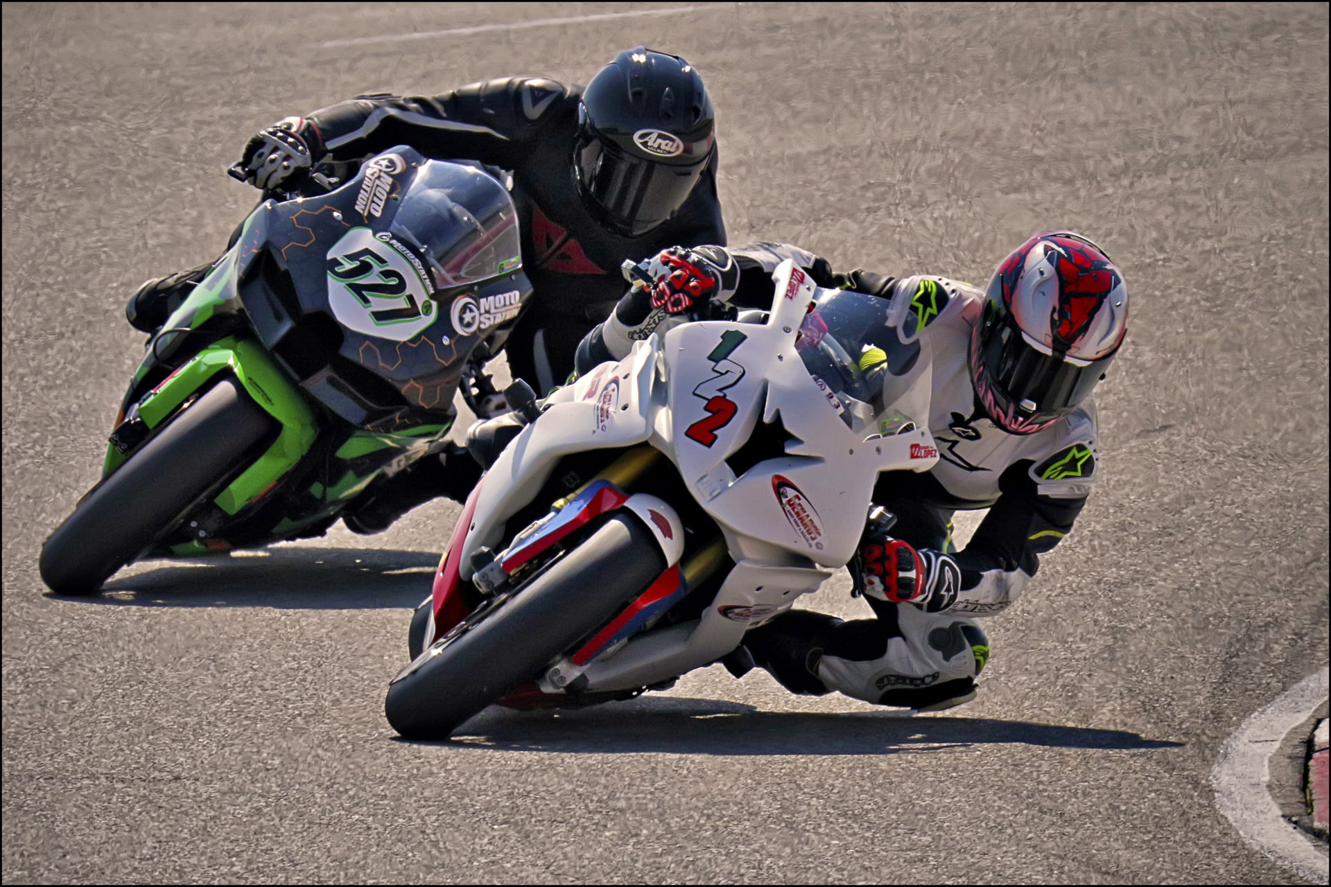 Genaro Lopez (122) fends off Jerry Hicks (527) in the final corner during Round 6 of the UtahSBA’s King of the Mountain Race held at Utah Motorsports Campus’ East Track. Photo by Steve Midgley, courtesy UtahSBA.