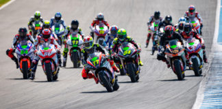 Dominique Aegerter (77) leads the MotoE World Cup field into a turn. Photo courtesy Dorna.