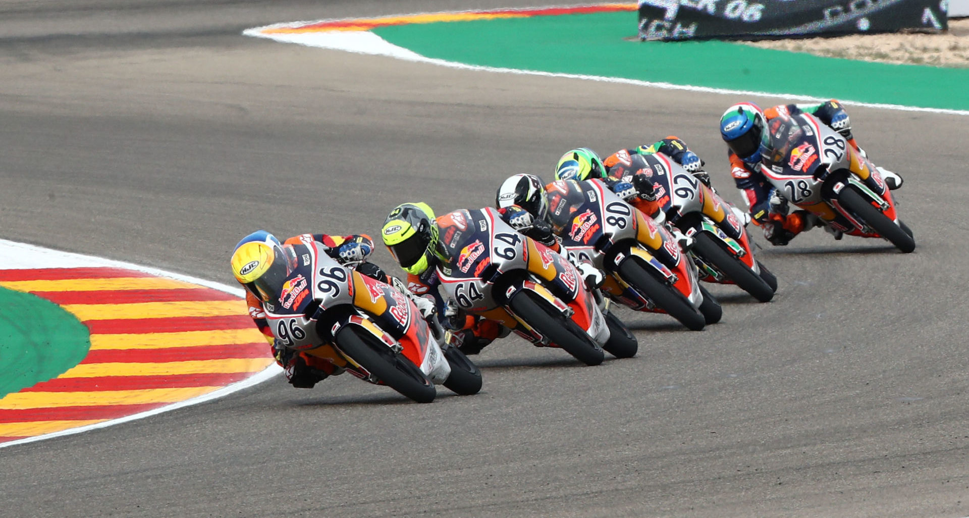 Daniel Holgado (96) leads Daniel Munoz (64), David Alonso (80), Diego Moreira (92), and Matteo Bertelle (28) during Red Bull MotoGP Rookies Cup Race One at Motorland Aragon. Photo courtesy Red Bull.