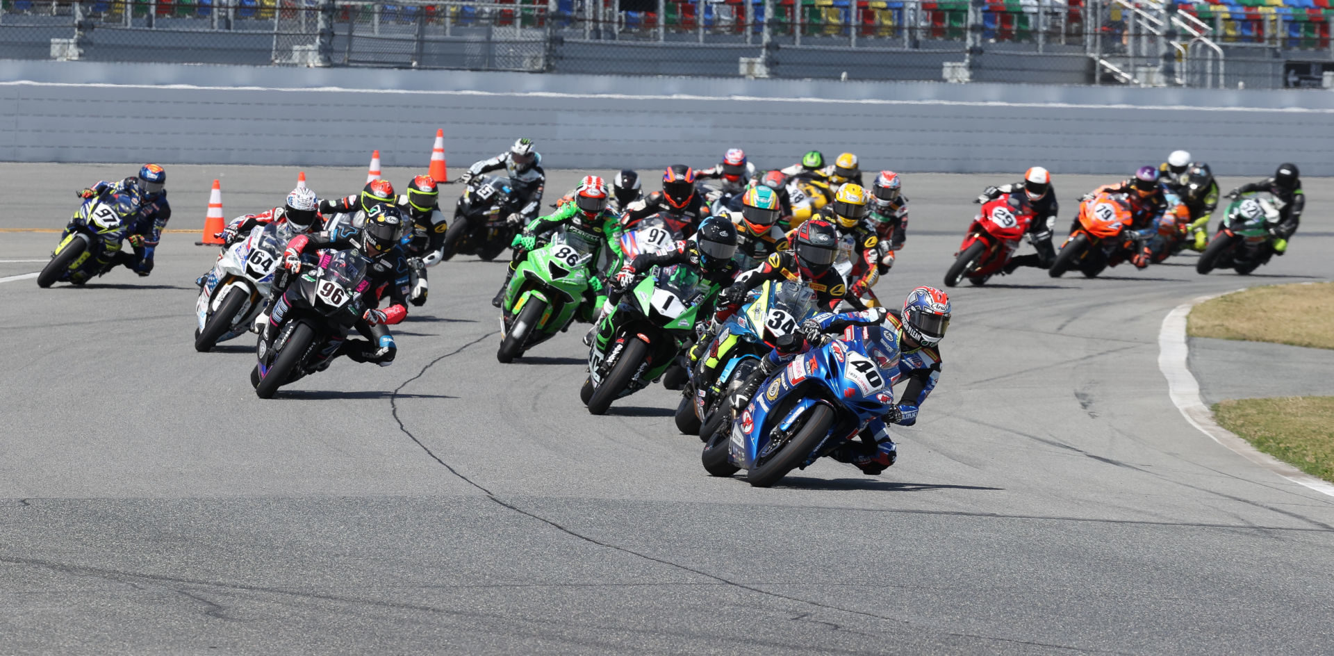 Sean Dylan Kelly (40) leads Michael Barnes (34), Kyle Wyman (1), Brandon Paasch (96), and the rest of the field at the start of the 79th Daytona 200, in 2021. Photo by Brian J. Nelson.