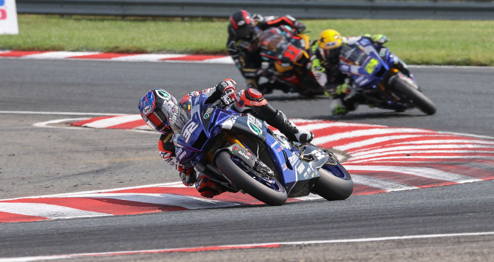 Jake Gagne (32) leads Toni Elias (24) and Mathew Scholtz (11) at New Jersey Motorsports Park. Photo by Brian J. Nelson, courtesy Yamaha.