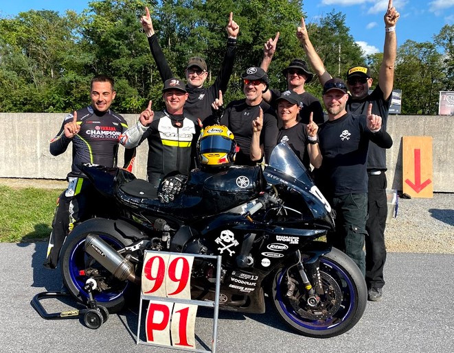 The 2021 N2/WERA National Endurance Overall Champions Army Of Darkness (from left): Chris Peris, Ben Walters, Chris Manfrin, Sam Fleming, Melissa Berkoff, Tim Gooding, YT Lechner, and Anthony Consorte. Photo courtesy Army of Darkness.