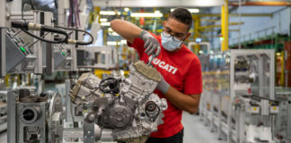 A worker assembling an engine on the production line at the Ducati factory in Italy. Photo courtesy Ducati.
