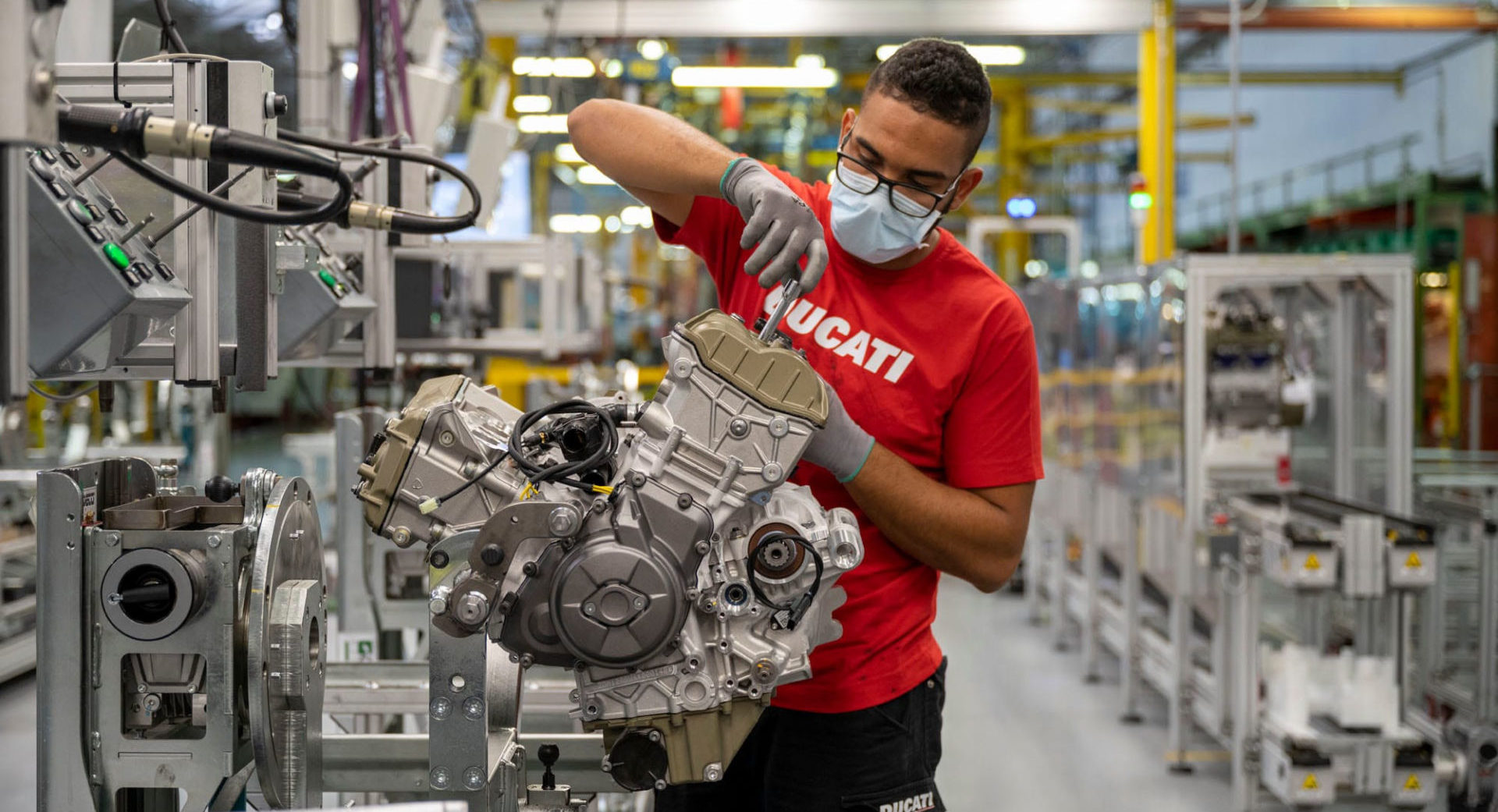 A worker assembling an engine on the production line at the Ducati factory in Italy. Photo courtesy Ducati.