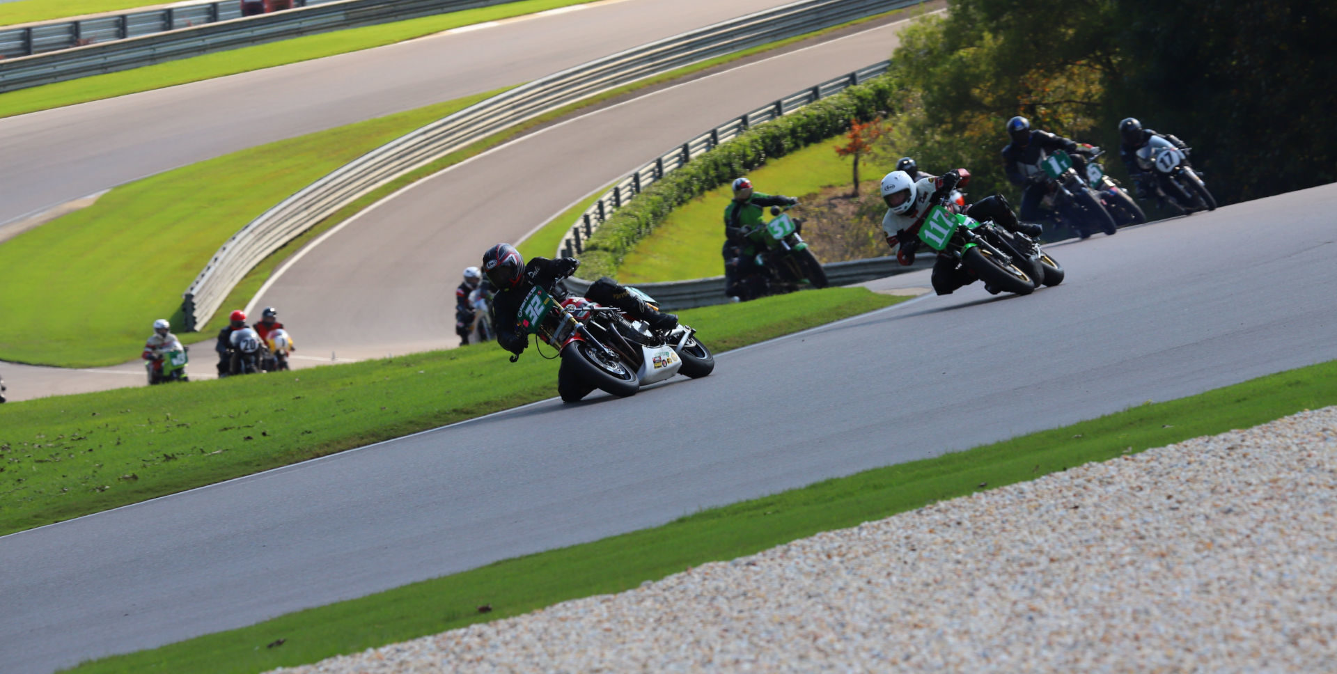 Action from the AHRMA Vintage Superbike Heavyweight race on October 9 with Dale Quarterley (32Q) leading David Crussell (117), Dennis Parrish (1R), Kenny Cummings (17), Martin Jarusek (31), and Curtis Adams (045) into Turn Two at Barber Motorsports Park. Photo by etechphoto.com, courtesy AHRMA.