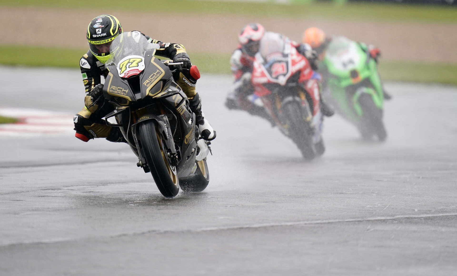 Kyle Ryde (77) leads Christian Iddon (21) and Lee Jackson (14) during wet British Superbike Race One at Donington Park. Photo courtesy MSVR.