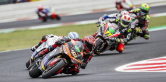 Jordi Torres (40) leads a group of riders during a MotoE World Cup race in 2021. Photo by Jesus Robledo, courtesy Energica.