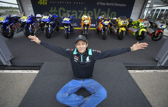 Valentino Rossi reunites with all of his World Championship-winning racebikes, which are arranged in chronological order from right to left. Photo courtesy Dorna. Valentino Rossi reunites with all of his World Championship-winning racebikes, which are arranged in chronological order from right to left. Photo courtesy Dorna.