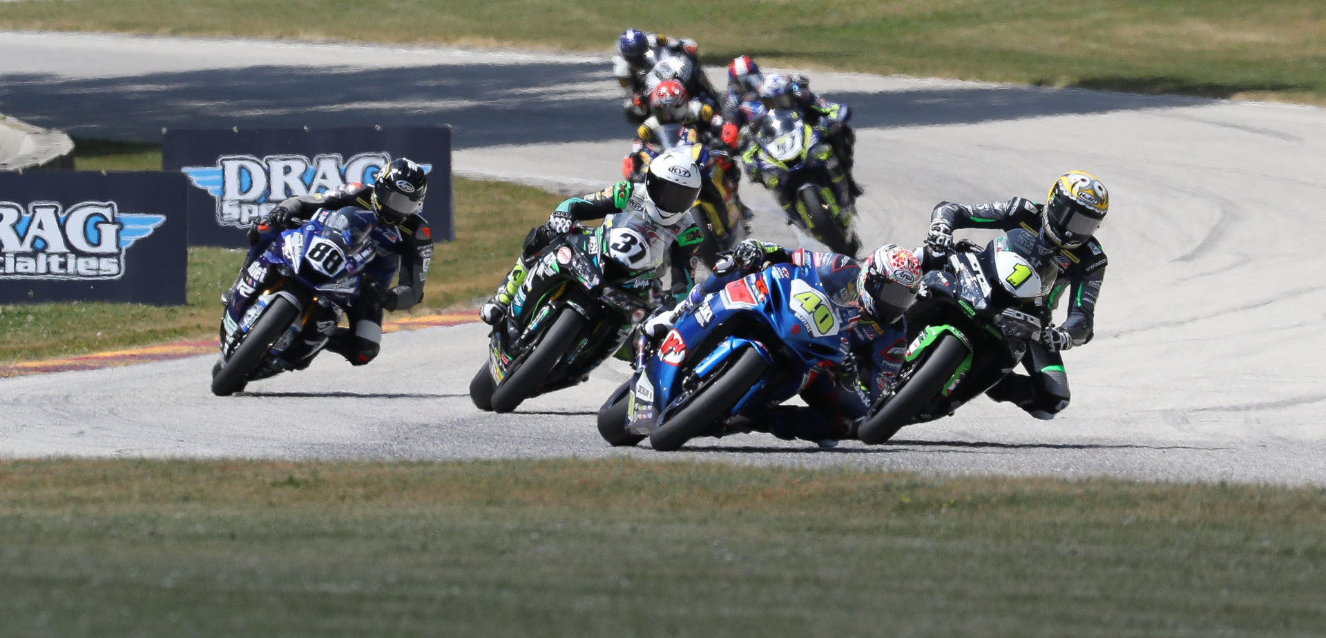 The MotoAmerica Supersport class has featured very close racing, as seen here at Road America in 2021 when Sean Dylan Kelly (40), Richie Escalante (1), Stefano Mesa (37), and Benjamin Smith (88) contested the lead. Photo by Brian J. Nelson.
