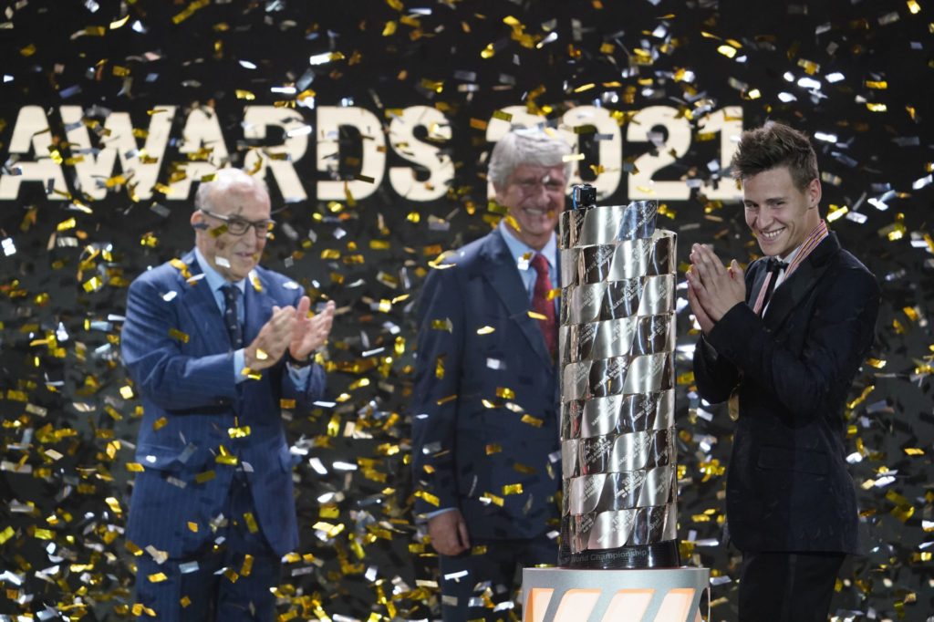 Dorna CEO Carmelo Ezpeleta (left) and FIM President Jorge Viegas (center) present Fabio Quartararo (right) with the MotoGP World Championship trophy. Photo courtesy Dorna.