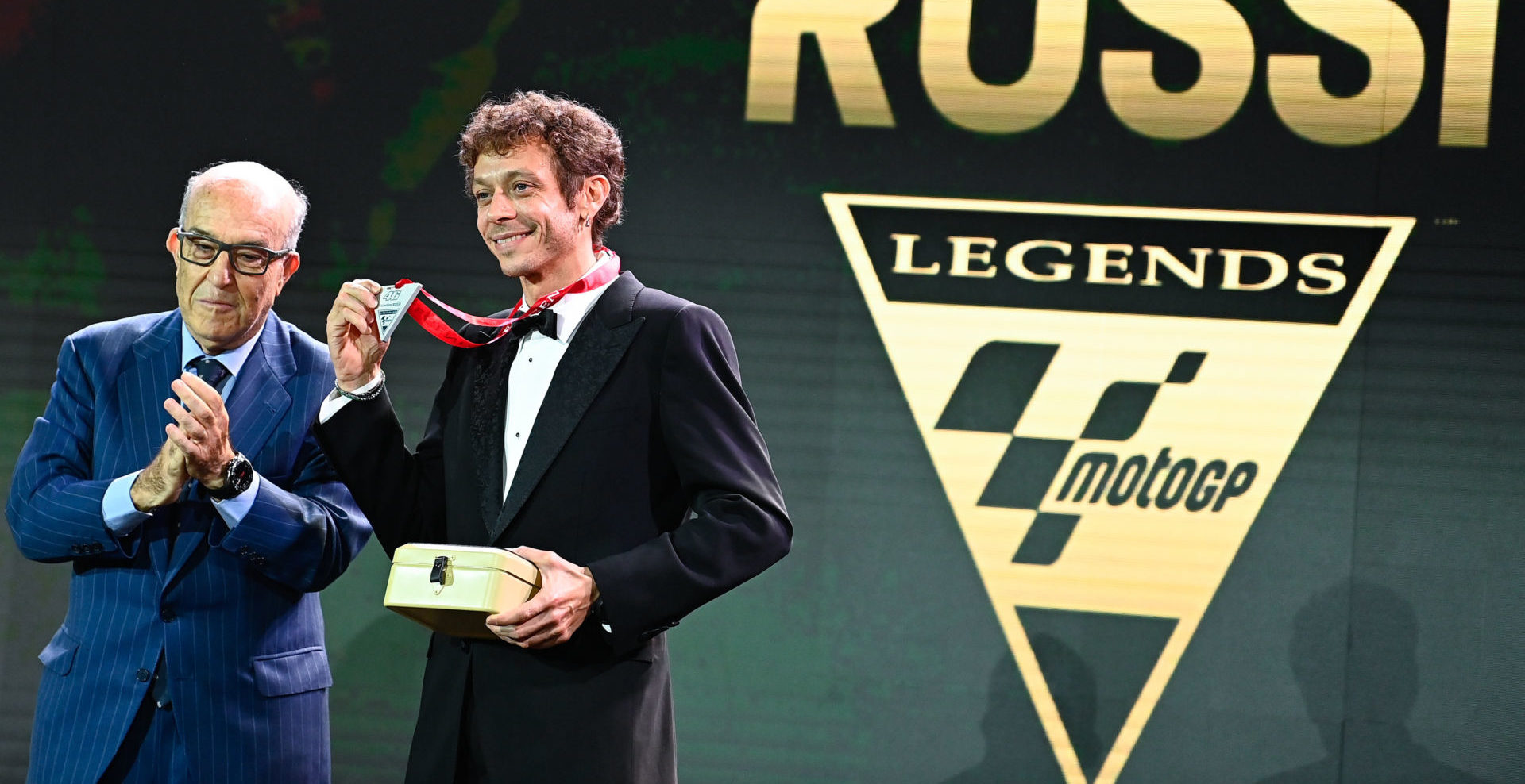 Dorna CEO Carmelo Ezpeleta (left) presents Valentino Rossi (right) with his MotoGP Legends medal. Photo courtesy Dorna.