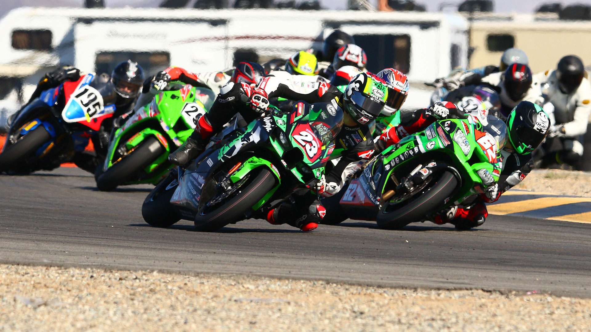 Corey Alexander (23), Andy DiBrino (62), and Michael Gilbert (behind Alexander) battle for the lead at the start of the CVMA Open Shootout race at Chuckwalla Valley Raceway. Photo by CaliPhotography.com, courtesy CVMA.