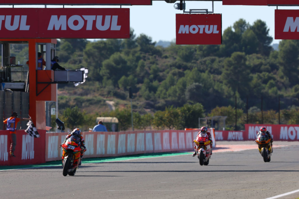 Raul Fernandez (25) takes the checkered flag at Valencia. Photo courtesy Dorna.