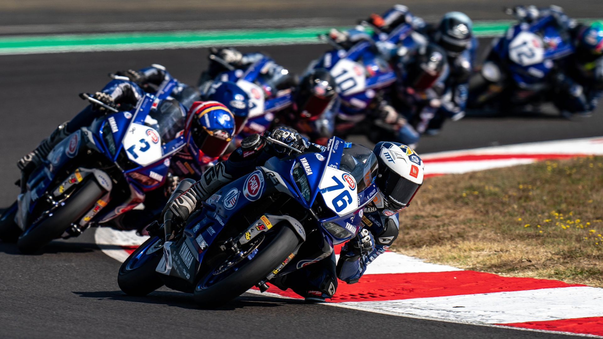 Julian Giral (76) and Iker Garcia Abella (2) lead a group of Yamaha R3 bLU cRU European Cup riders during the 2021 season. Photo courtesy Yamaha.