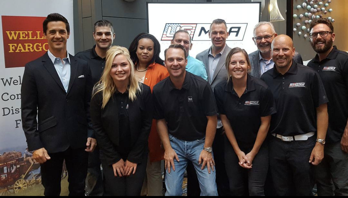 Wells Fargo Distribution Finance team members posing with U.S. Motorcycle Coaching Association (USMCA) board members. Photo and caption courtesy USMCA.