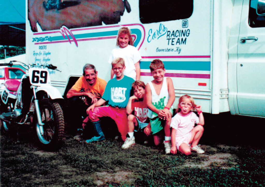 Earl Hayden's first sponsor, George "JR" Boone, poses with a racebike and the Hayden kids (from left) Jenny, Tommy, Roger, Nicky, and Kathleen, circa 1993. Photo courtesy Hayden family.
