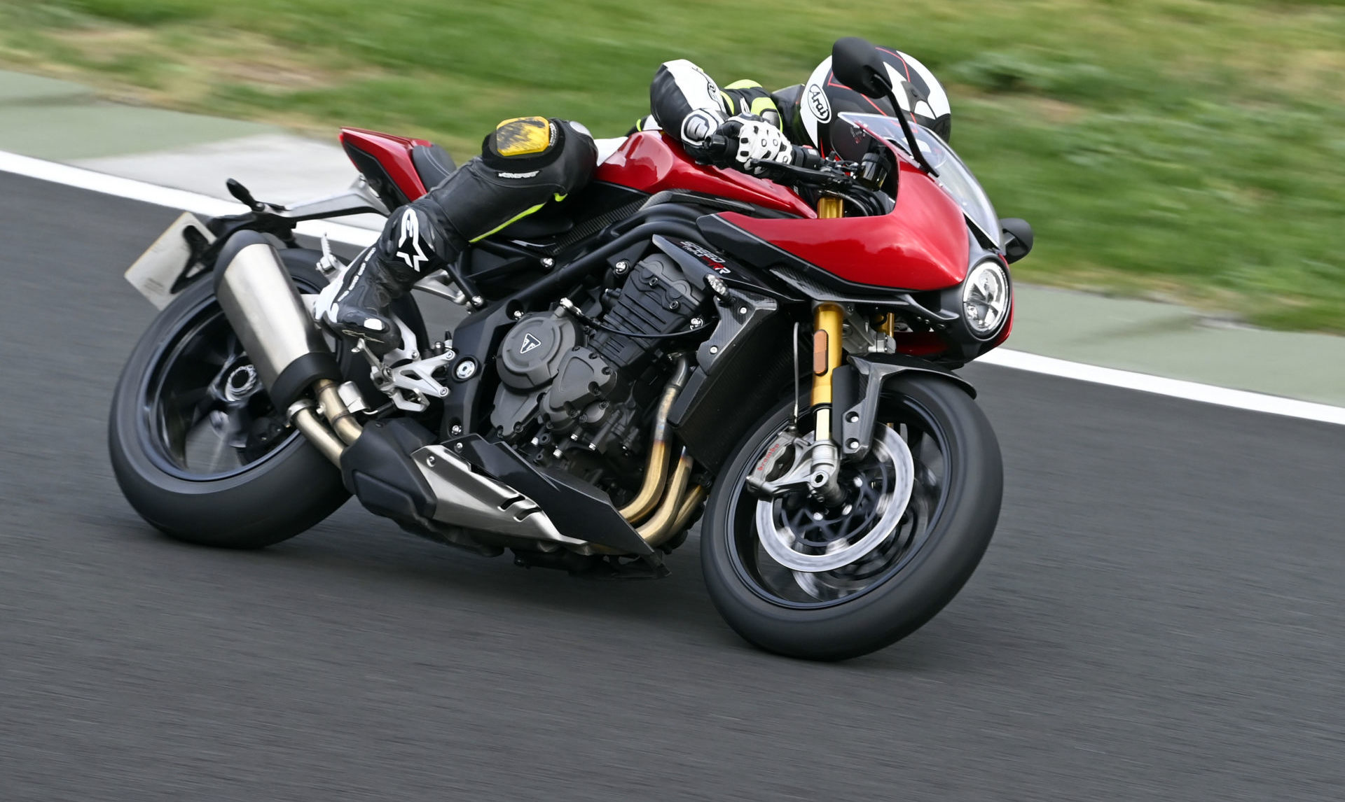 While the Triumph Speed Triple RR is designed for street use, its power (and the usability of that power), and its stable but still nimble chassis, sophisticated suspension, and solid brakes mean that it is quite comfortable on a racetrack. Photo courtesy Triumph.