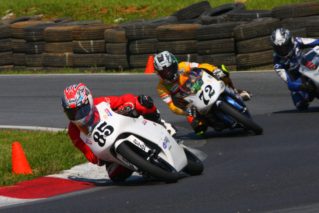 Jake Lewis (85), Miles Thornton (72), and Hayden Gillim (right) during a USGPRU Moriwaki Honda MD250H race during a CCS weekend at Summit Point in 2008. Photo by etechphoto.com.