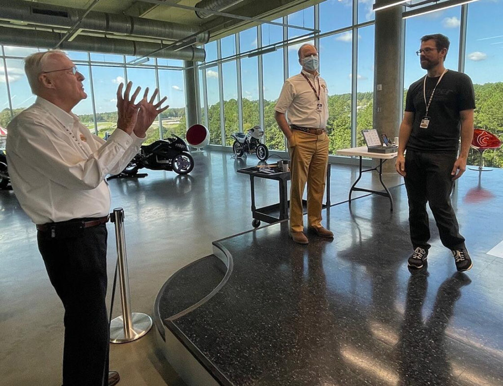 George Barber (left), the founder of Barber Motorsports Park and the Barber Vintage Motorsports Museum, speaks with Barber Advanced Design Center designer and director Brian Case (right). Photo courtesy Barber Motorsports Park.