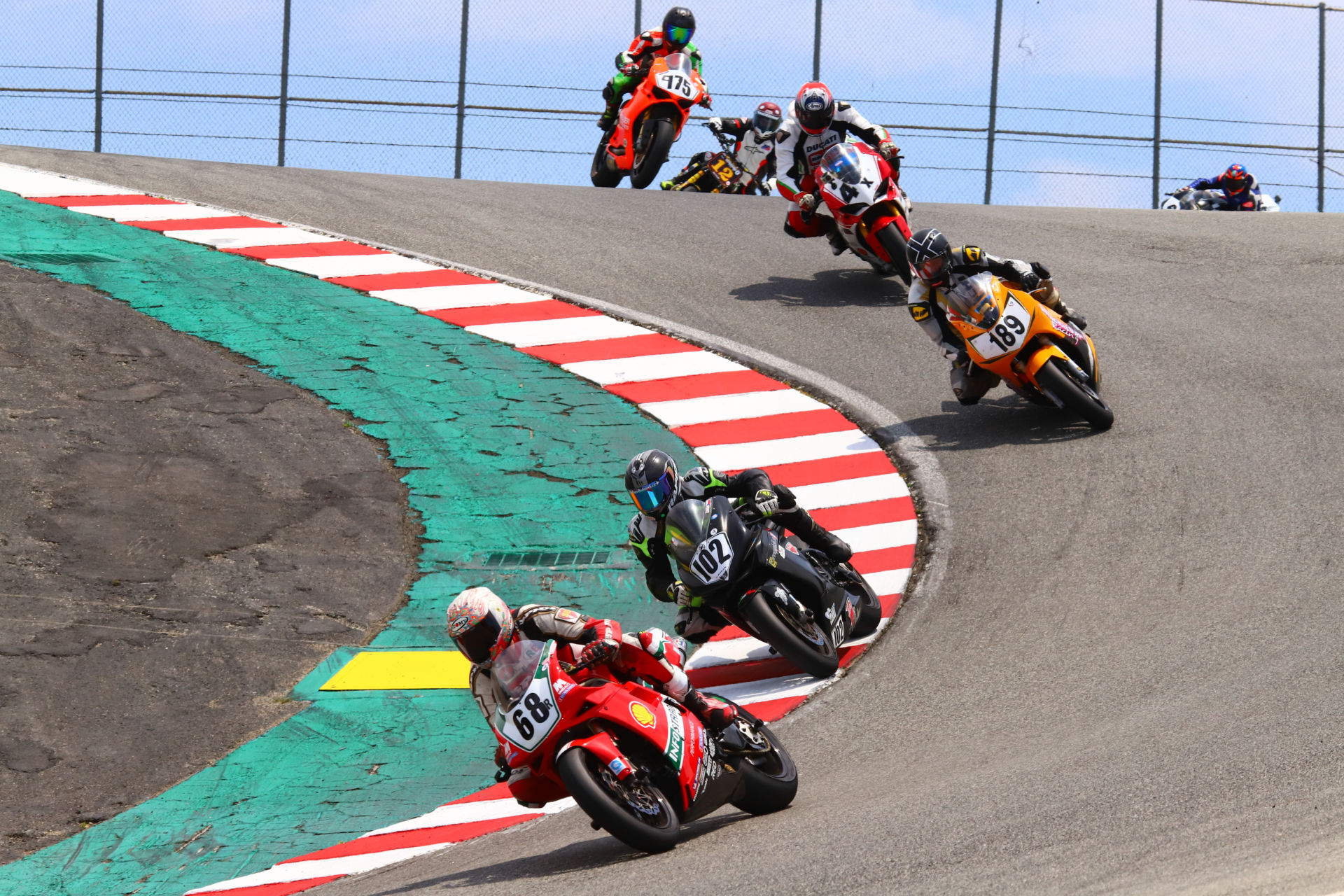 AHRMA Executive Director Craig Grantham (68) leads a group of AHRMA racers down the Corkscrew at Laguna Seca. Photo by etechphoto.com, courtesy AHRMA.