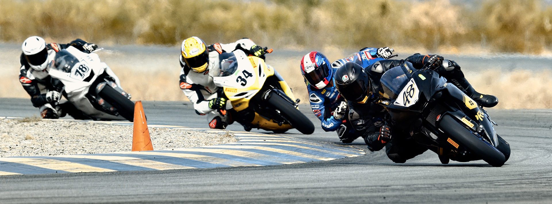 Chad Lewin (48) leads Sam Lochoff (behind Lewin), Rennie Scaysbrook (34), and Alejandro Thermiotis (78) in a CVMA race. Photo by CaliPhotography.com, courtesy CVMA.