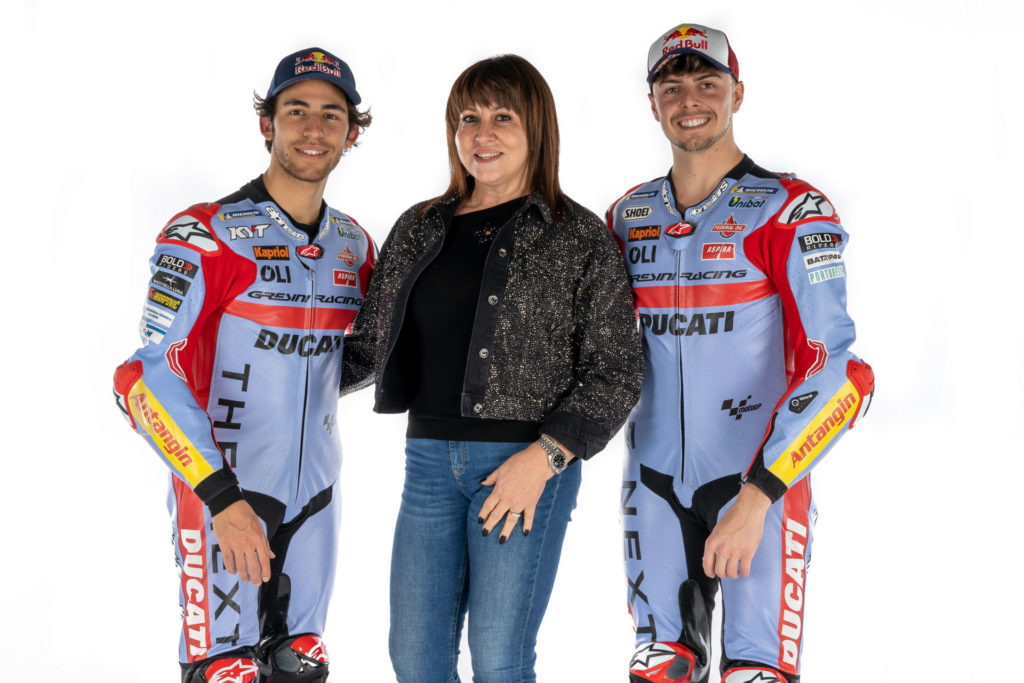 Team Gresini Racing MotoGP riders Enea Bastianini (left) and Fabio Di Giannantonio (right) with Team Owner Nadia Padovani Gresini (center). Photo courtesy Gresini Racing.