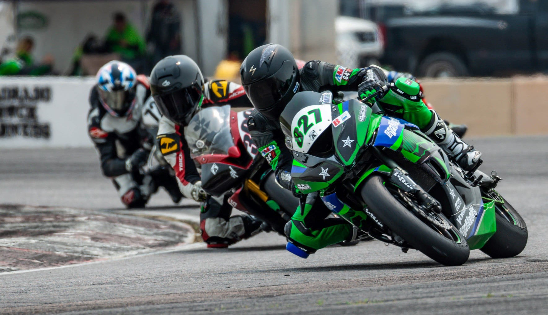 Josh Baker (827) leads other MRA racers out of Turn Five at Pikes Peak International Raceway during the 2021 season. Photo by Kelly Vernell, courtesy MRA.