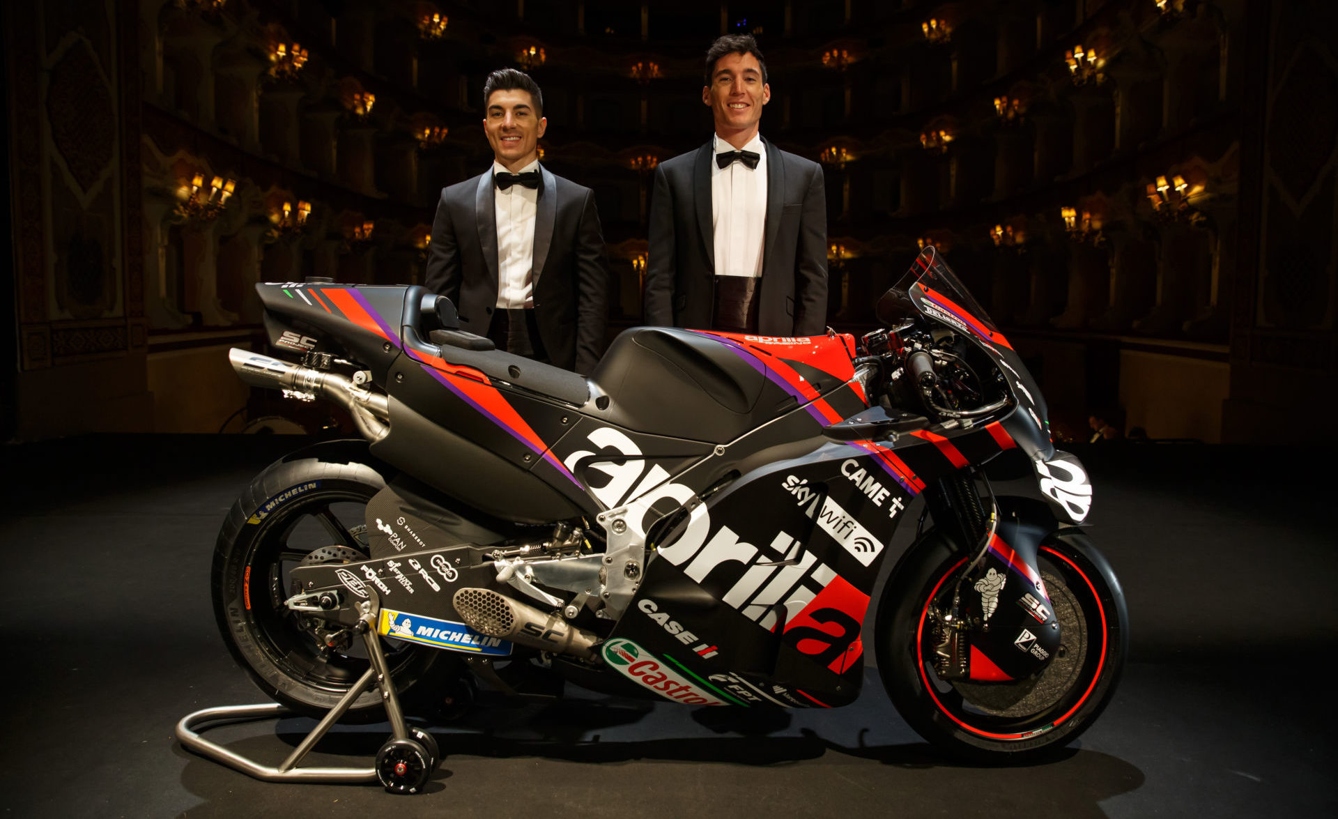 Maverick Vinales (left) and Aleix Espargaro (right) with an Aprilia RS-GP MotoGP racebike at the team's official introduction. Photo courtesy Aprilia.